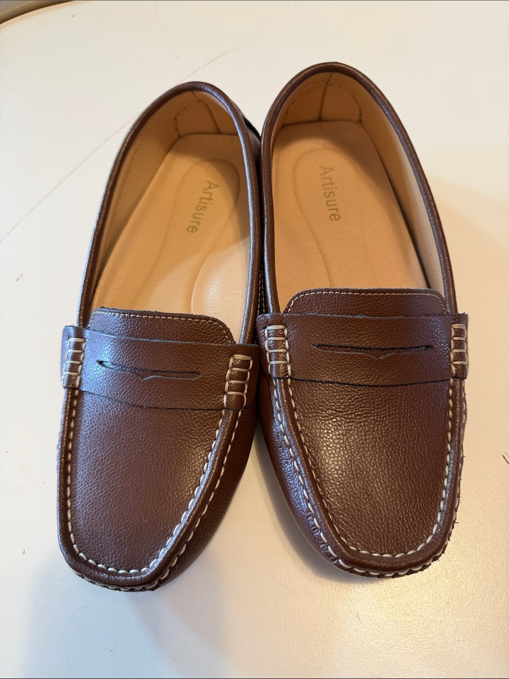 Artisure women’s penny loafers in brown.  Size 10. Excellent condition.
